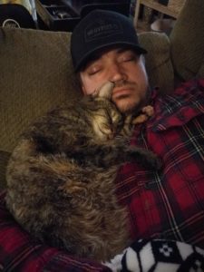 bella cat nasal tumor hugging her dad