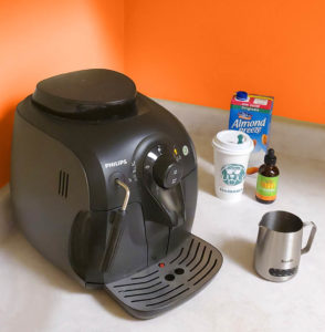 turmeric spice latte ingredients (philips coffee machine, unsweetened almond milk, starbarks cup, NHV Turmeric