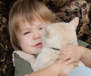 benefits-of-having-a-cat-as-aid-for-children-with-autism-boy-with-cat