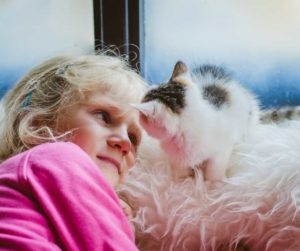 benefits-of-having-a-cat-as-aid-for-children-with-autism-girl-with-cat